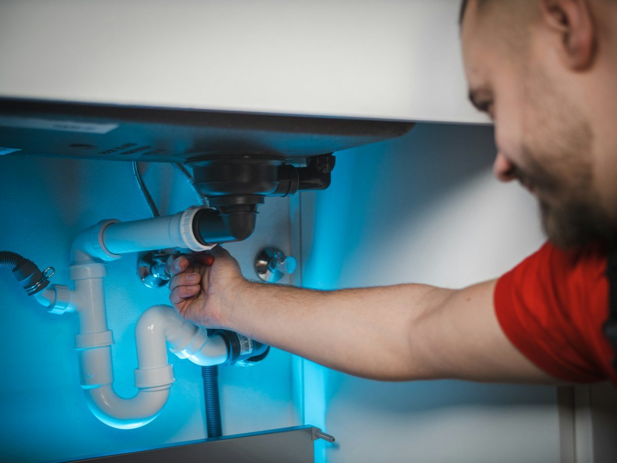 Pine Rooter plumber working through the garbage disposal service process in Bothell, WA